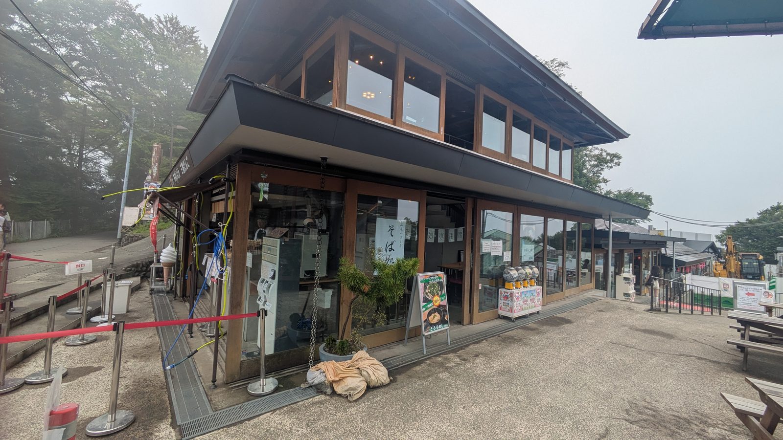 A wooden soba restaurant beside the trail near the summit