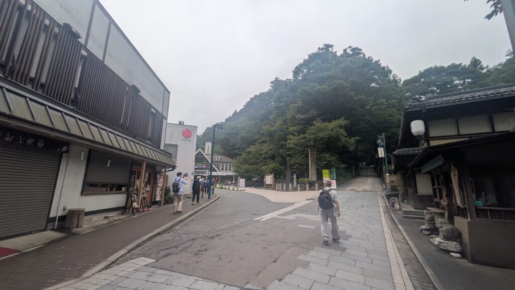 The approach street to the trailhead with shop shutters still closed in the morning