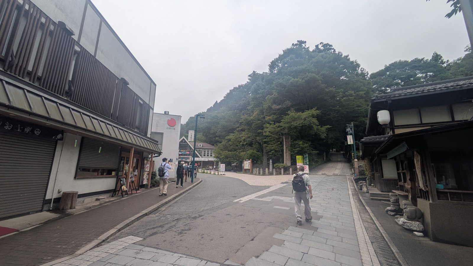 The approach street to the trailhead with shop shutters still closed in the morning