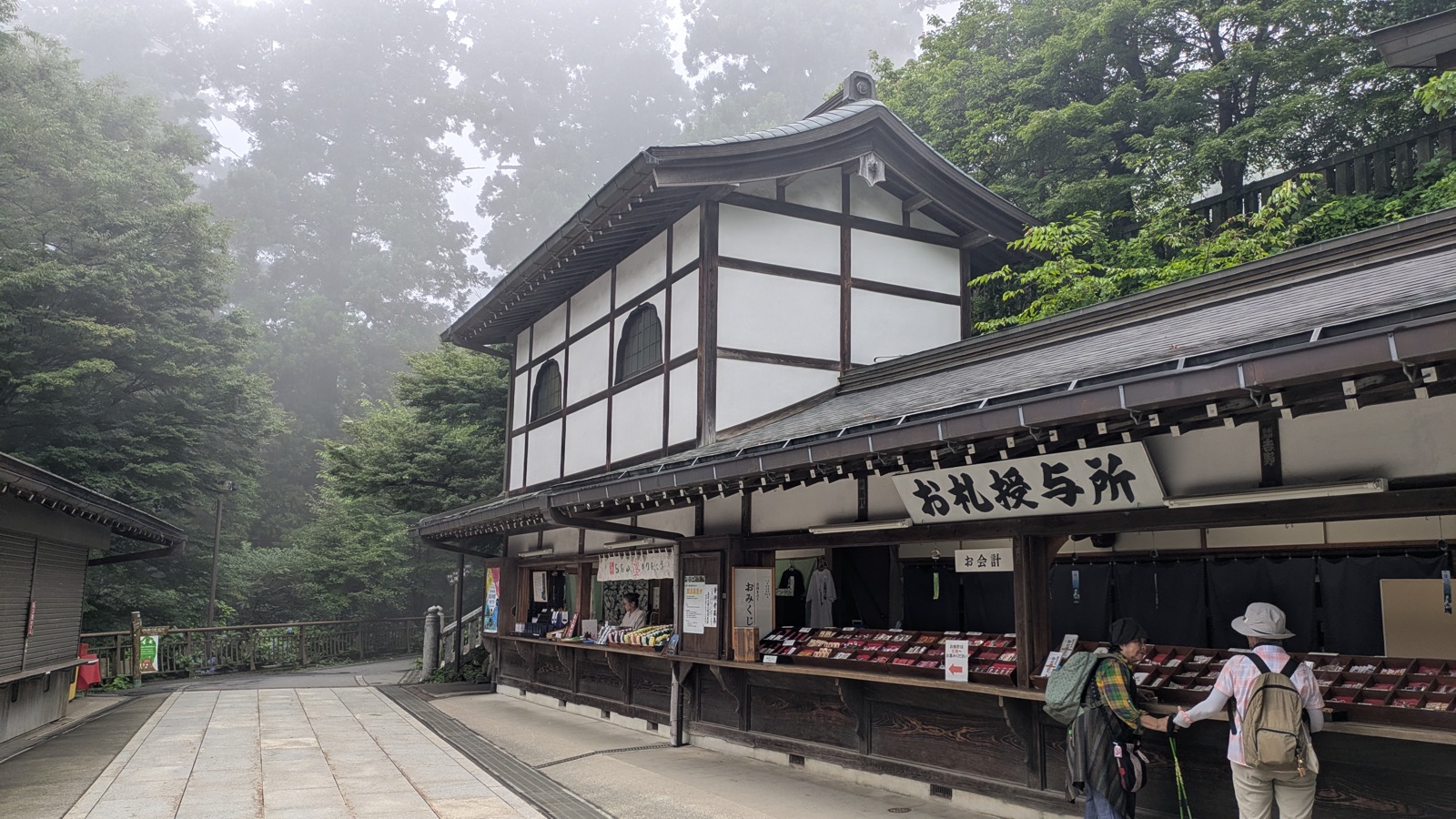 The long wooden amulet counter at Yakuo-in with amulets laid out in rows