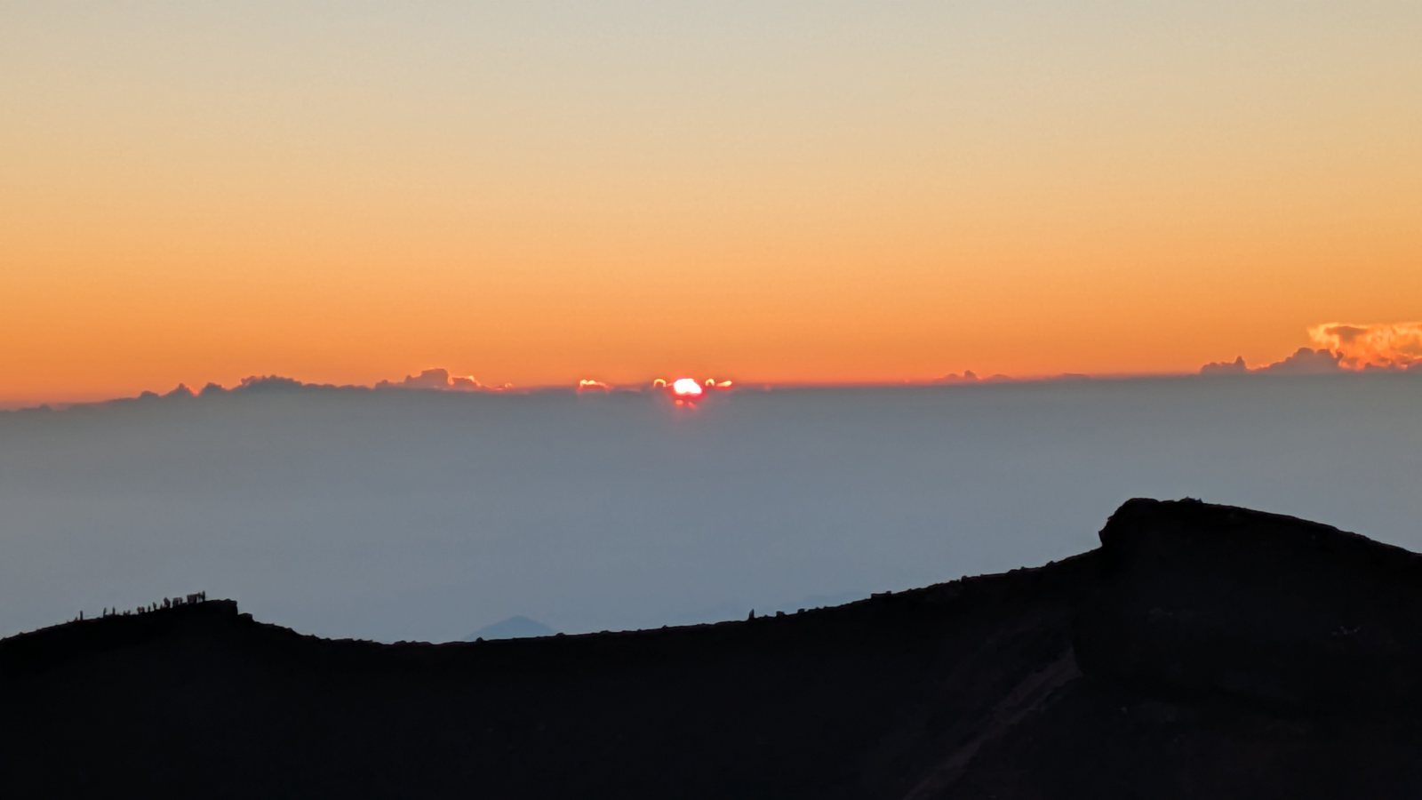 Sunrise seen from Kengamine, the highest point on the Mount Fuji crater rim