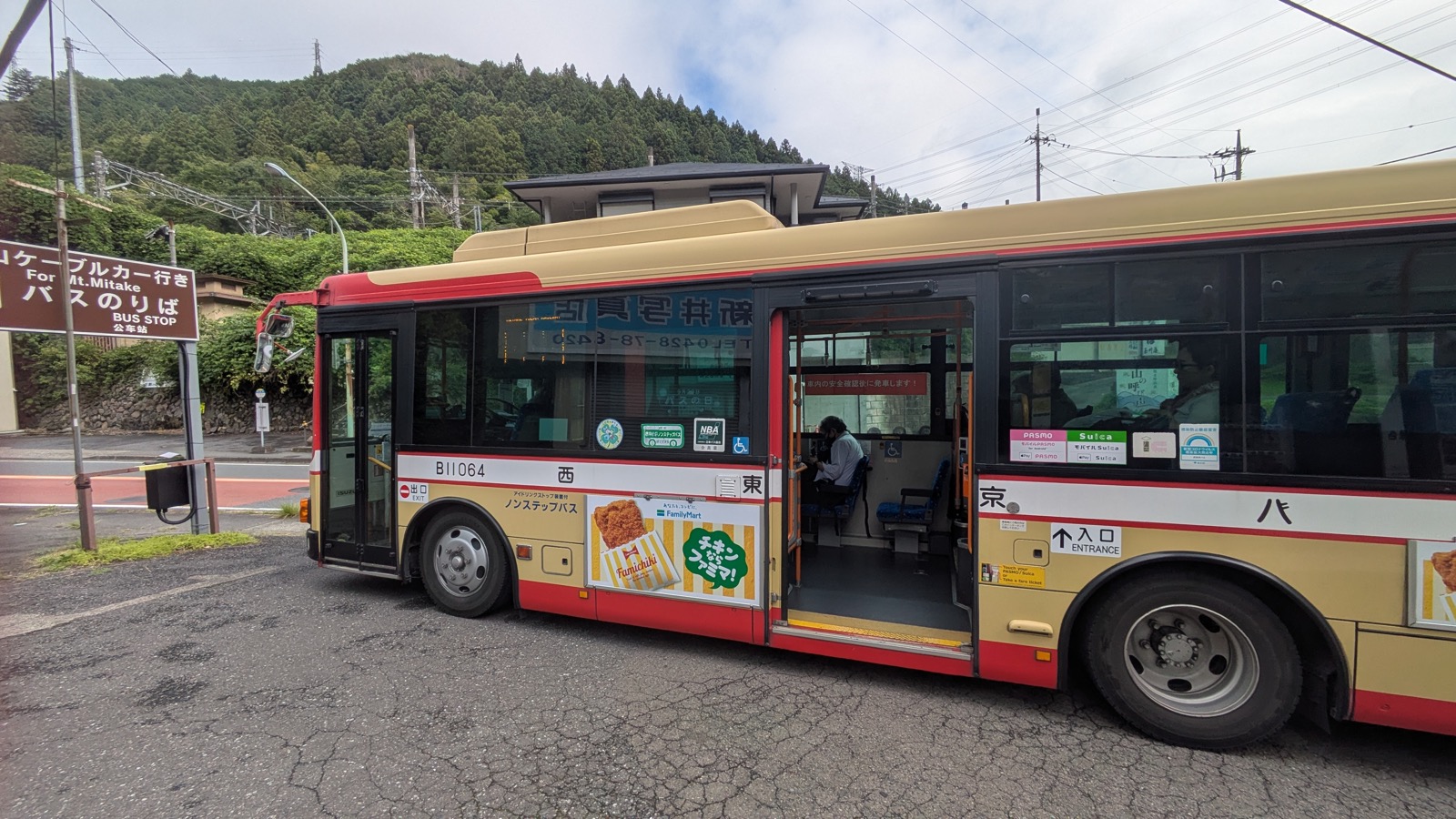 The middle door of a Japanese country bus, where passengers board