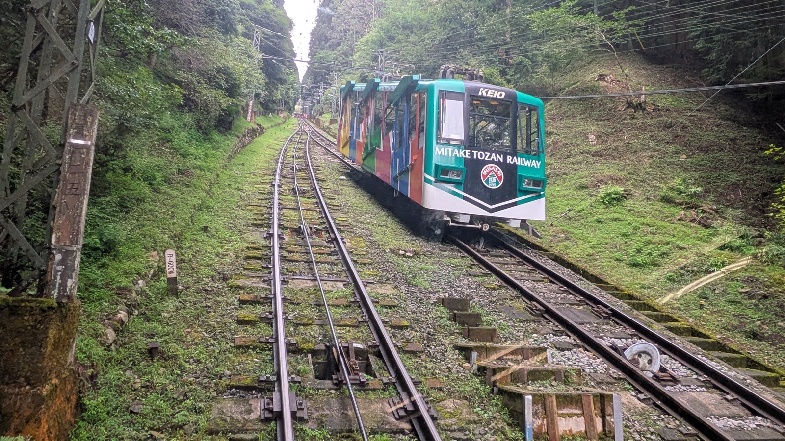 The view down the steep track of a funicular railway from inside the carriage