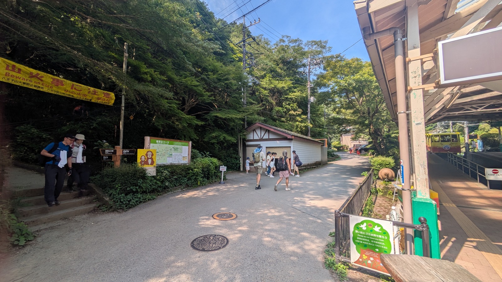 The open square at the foot of the Mount Takao cable car with stone steps on the left leading to another trail