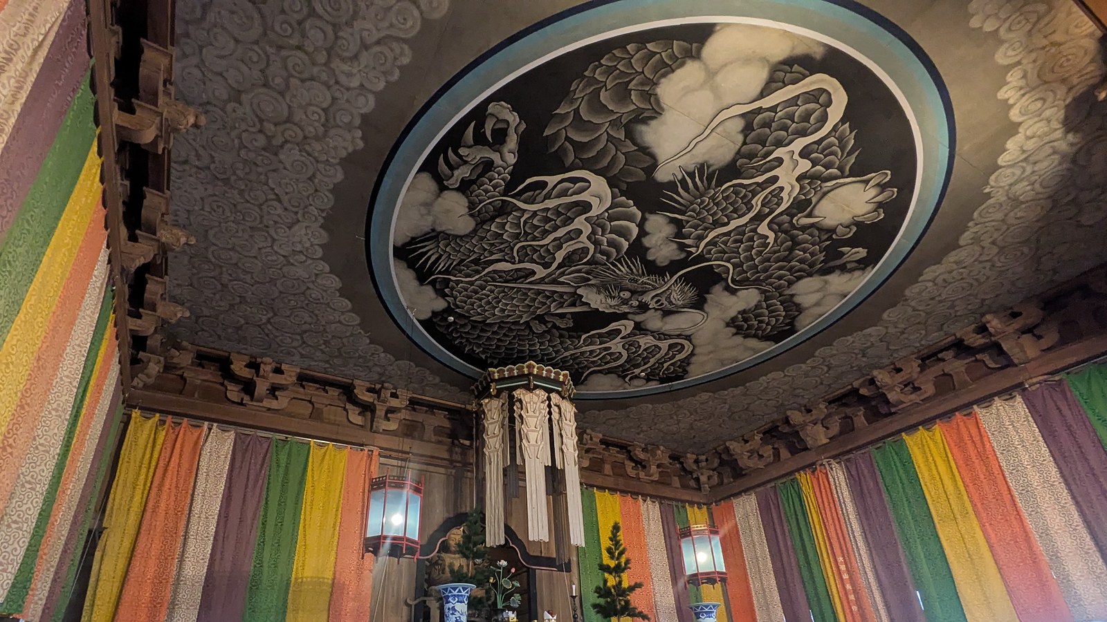 A cloud dragon painted on the ceiling of a temple hall